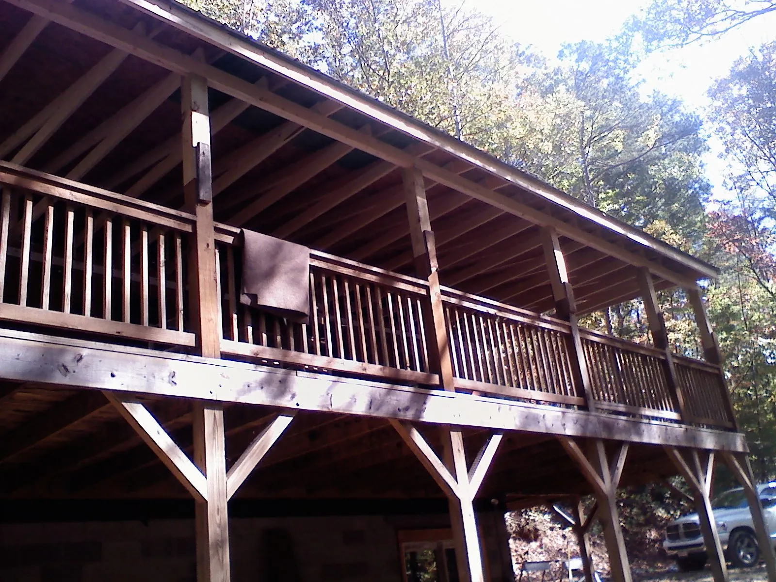 Timber framing under a new elevated porch and deck — Roof Leak Repair in East Brookfield by Roofing Brothers